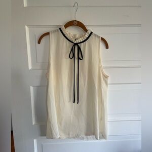 White Sleeveless Blouse with Black Details